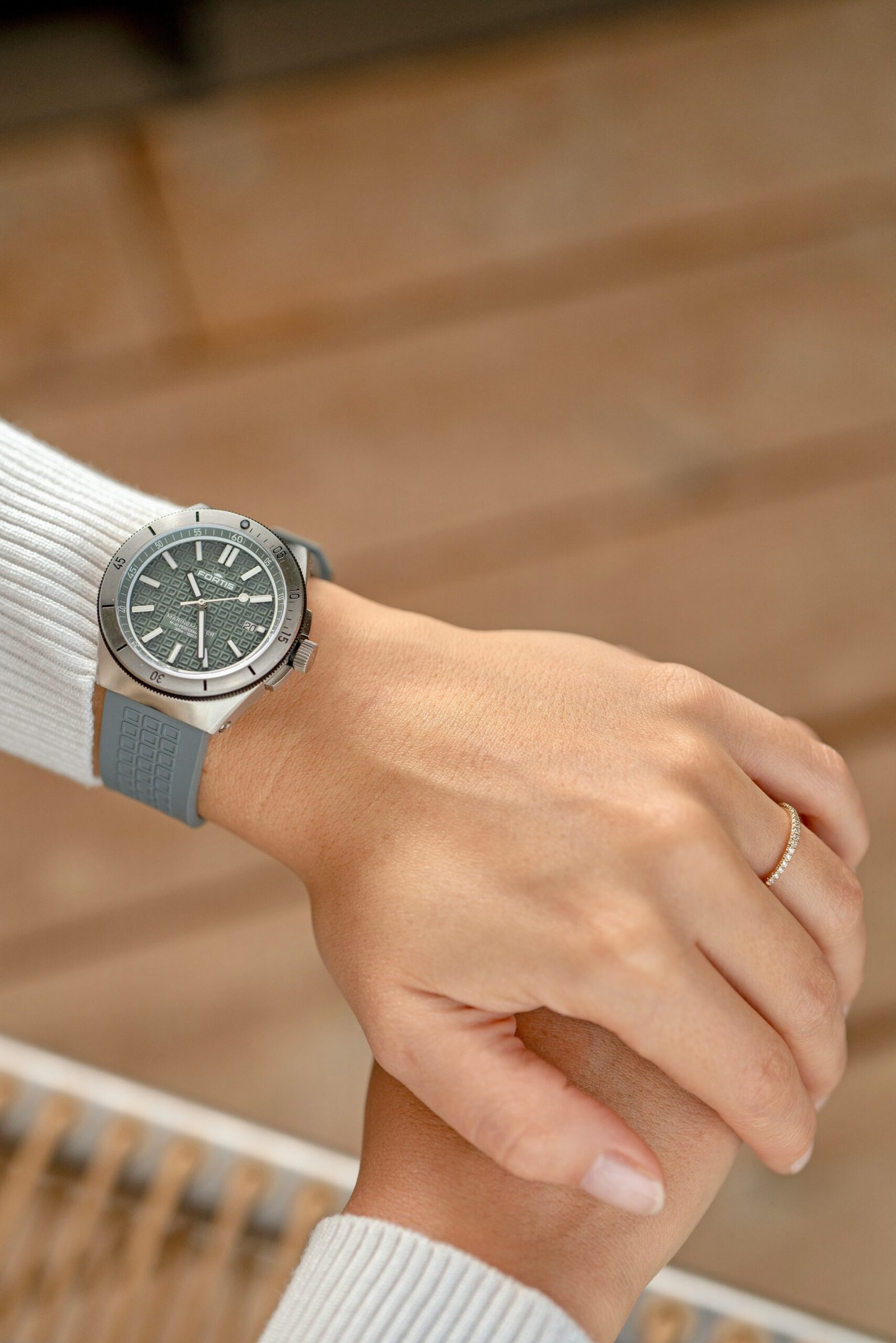 a person's hand with a watch on it